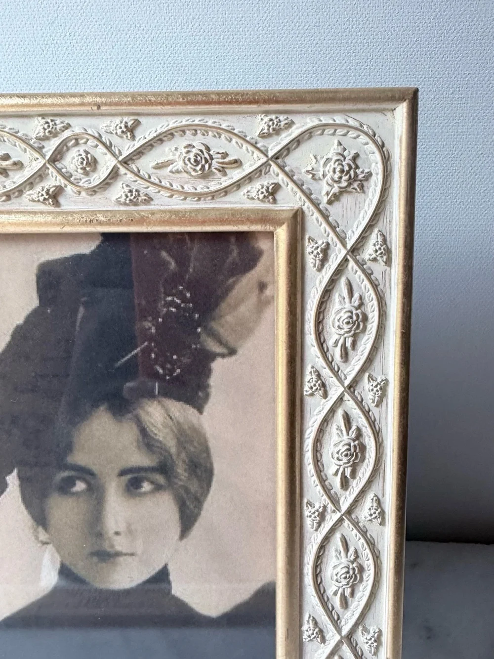 White metal decorative picture frame with gold accents